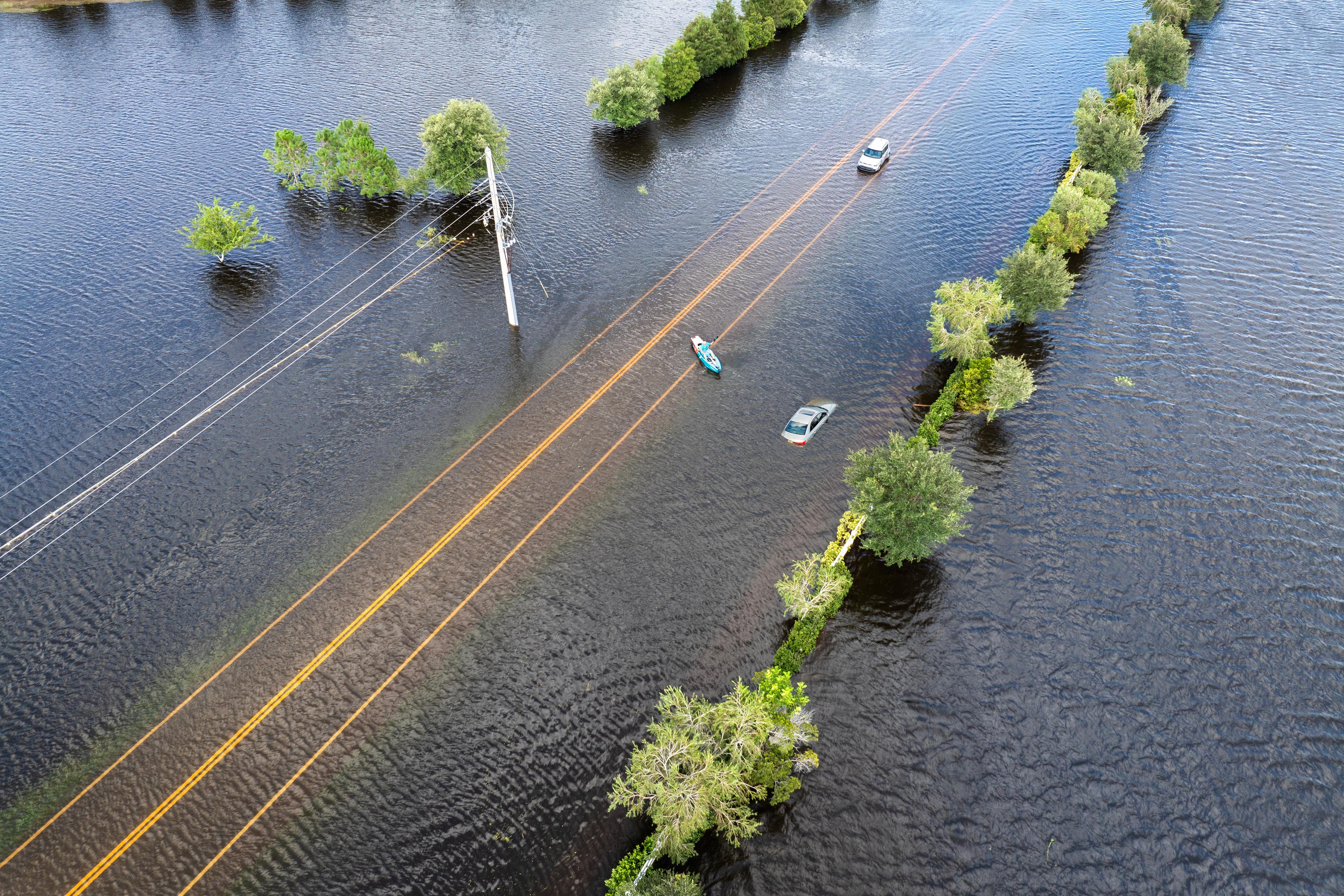 Flooded road with sunken car in surrounded with wa 2025 01 28 02 48 40 utc